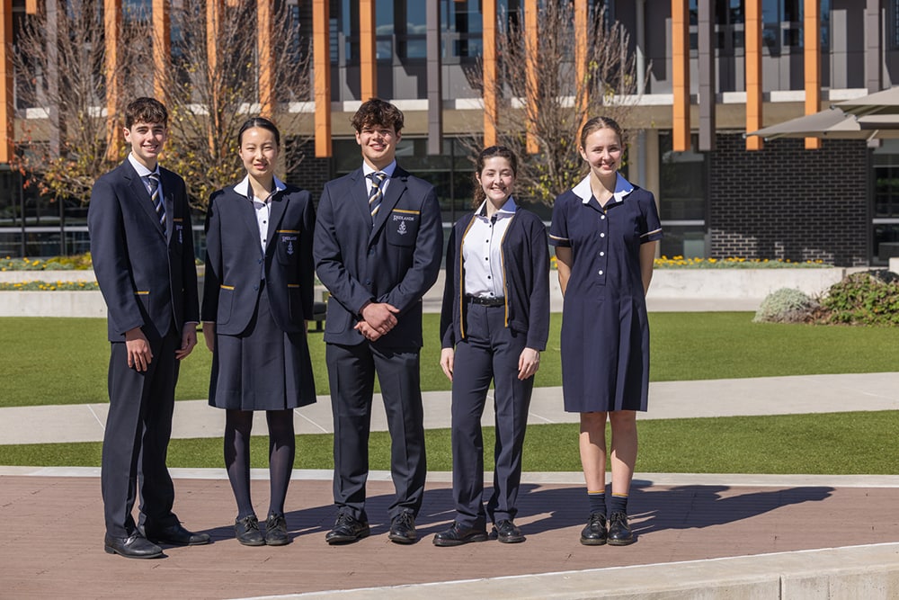 Redlands Secondary School students standing outside of the Learning Hub building